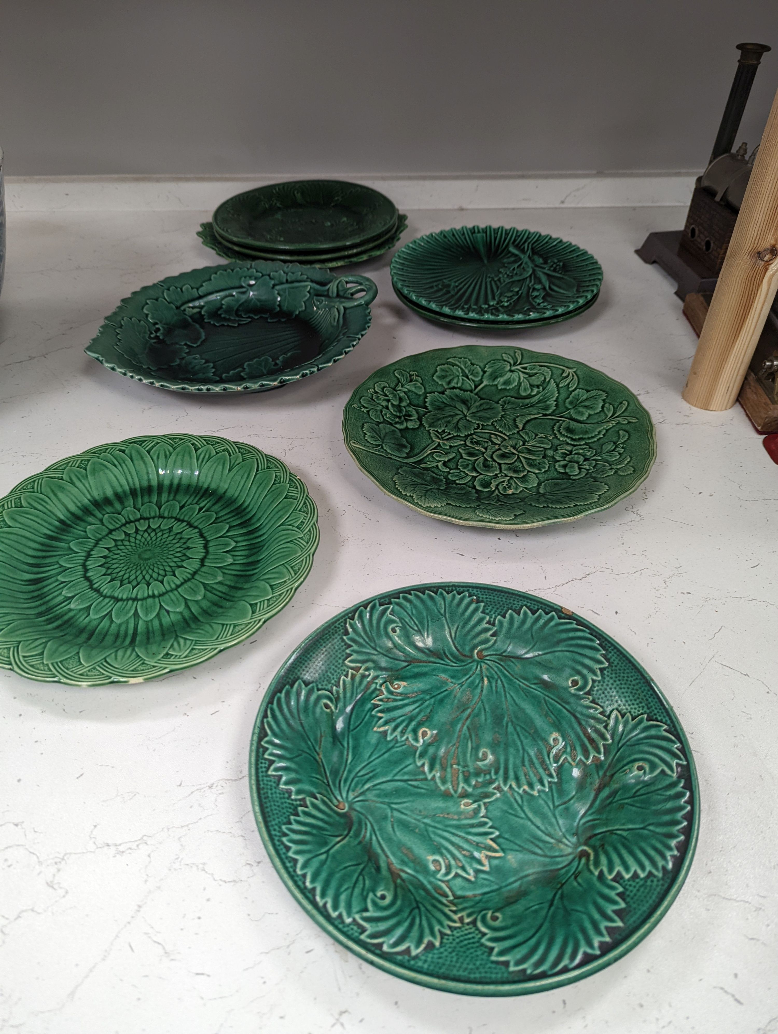 Twelve Victorian and later green glazed leaf dishes, largest 25.5cm
